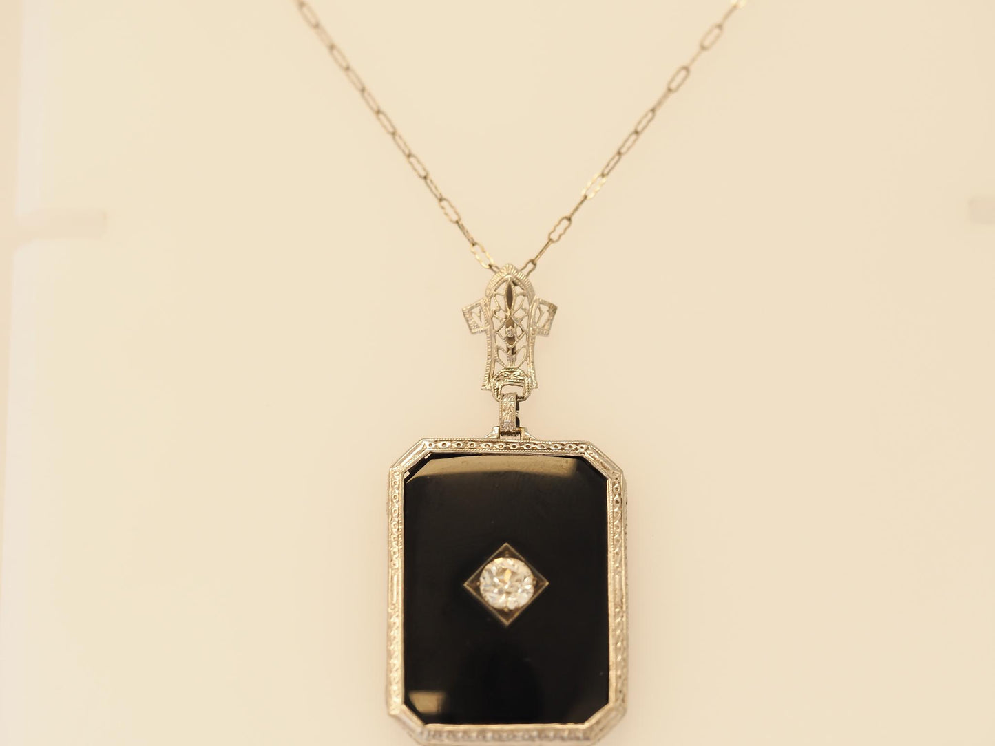 Circa 1920s Art Deco Onyx and .65ct Old European Diamond Necklace Pendant