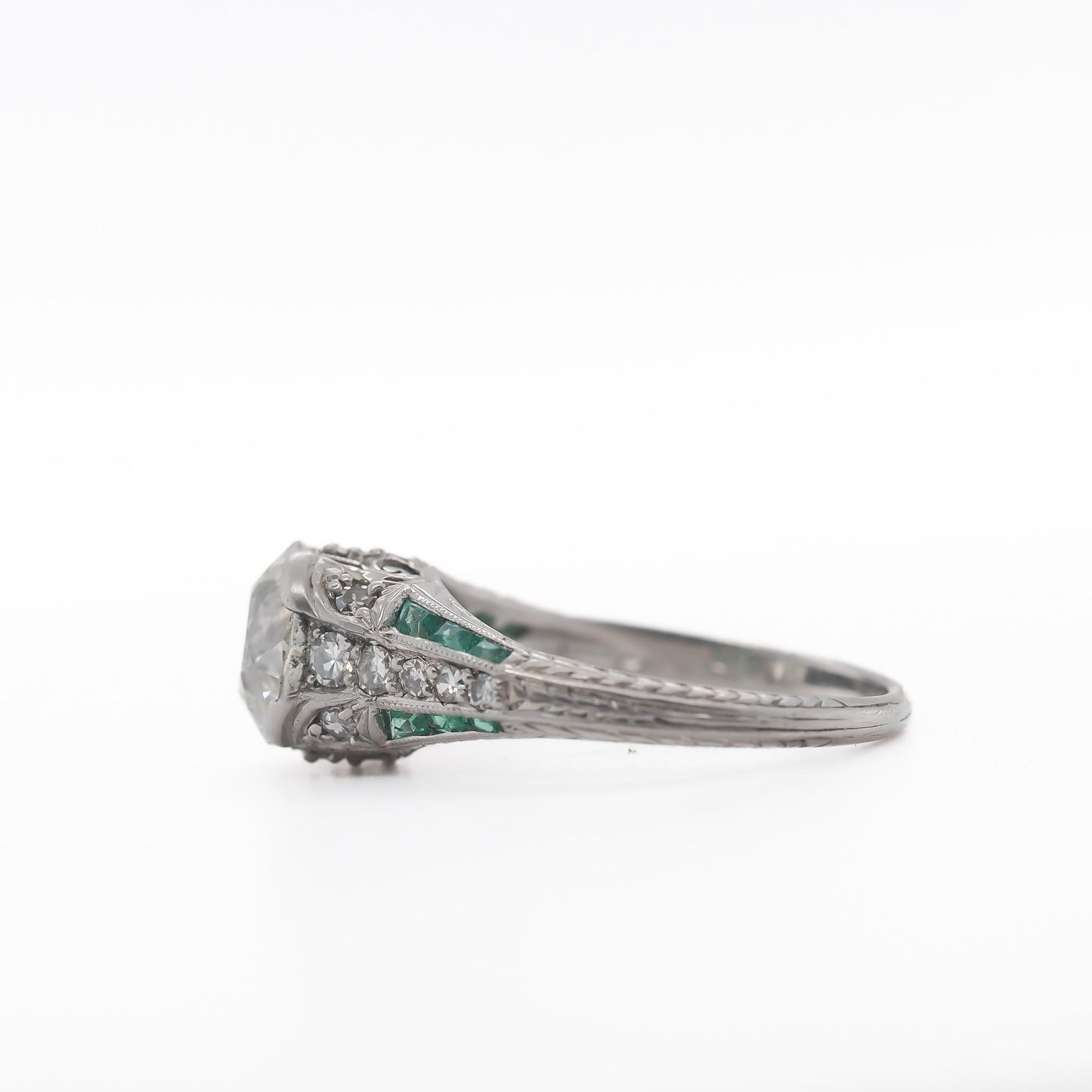 Circa 1920s Platinum 2.03ct Old European Cushion Diamond and Emerald Engagement