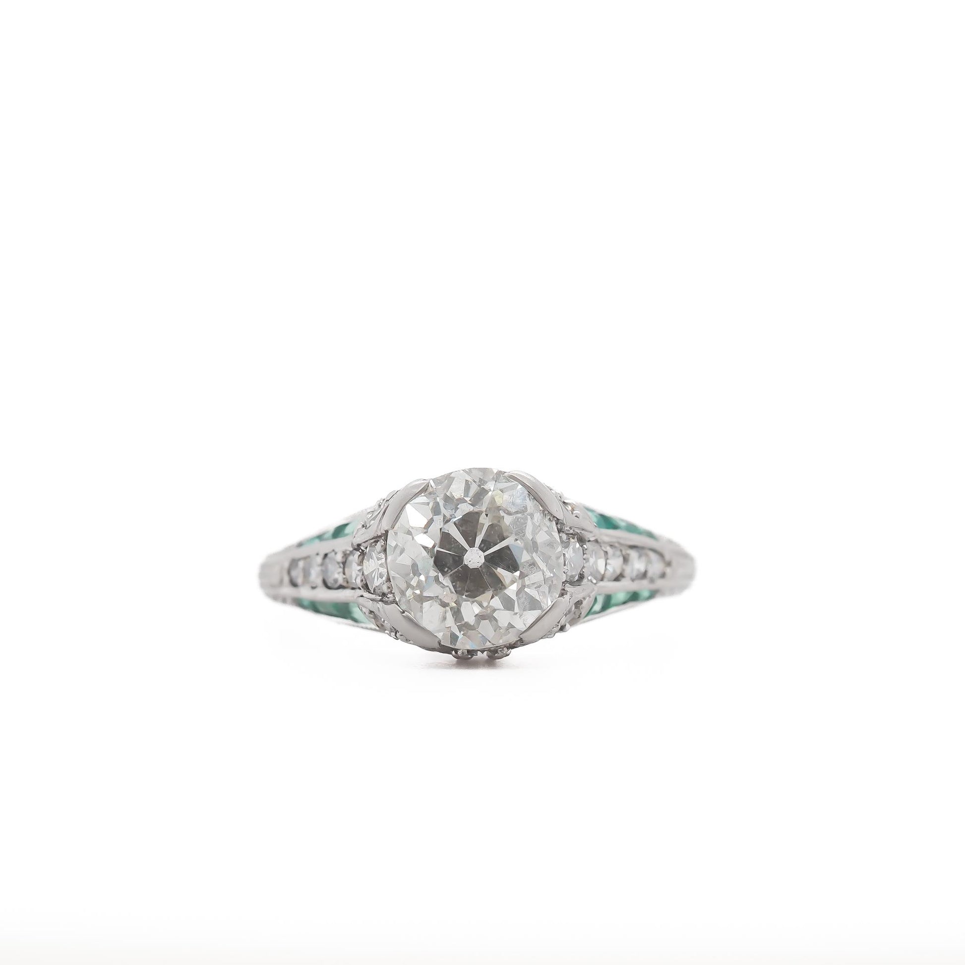 Circa 1920s Platinum 2.03ct Old European Cushion Diamond and Emerald Engagement