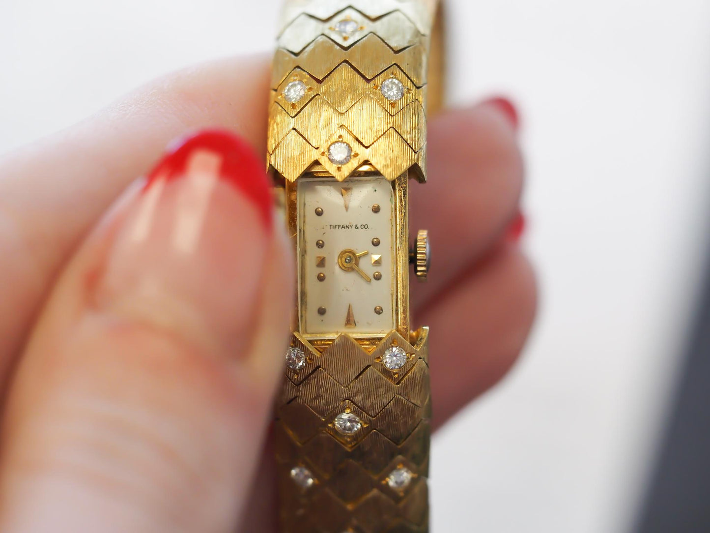 1950s Tiffany & Co. 18K Gold and Diamond  “Peek A Boo” Hidden Watch Bracelet