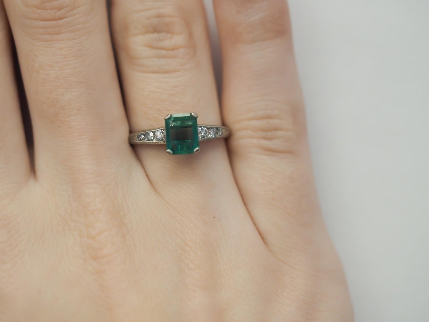 Circa 1920s Platinum Art Deco Emerald and Diamond Engagement Ring